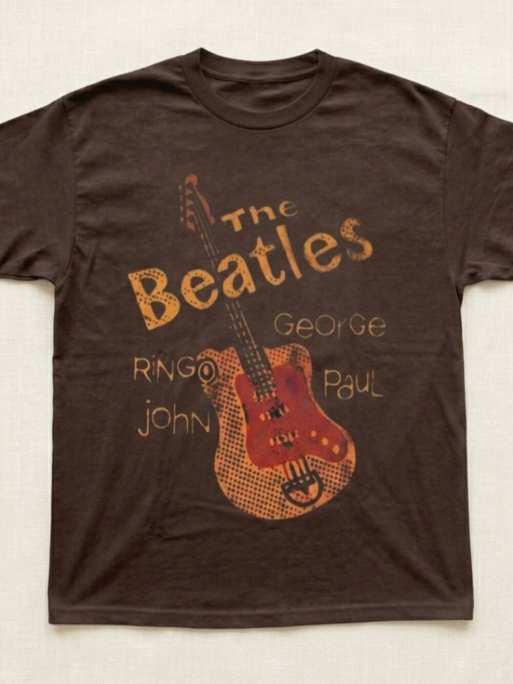 The Beatles brown t-shirt with red guitar graphic